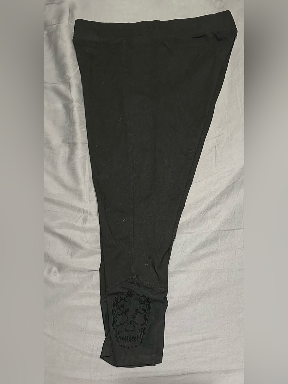 Torrid- Black Leggings with subtle Skull mesh on side calf